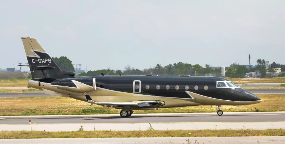 Dark private jet on an airfield