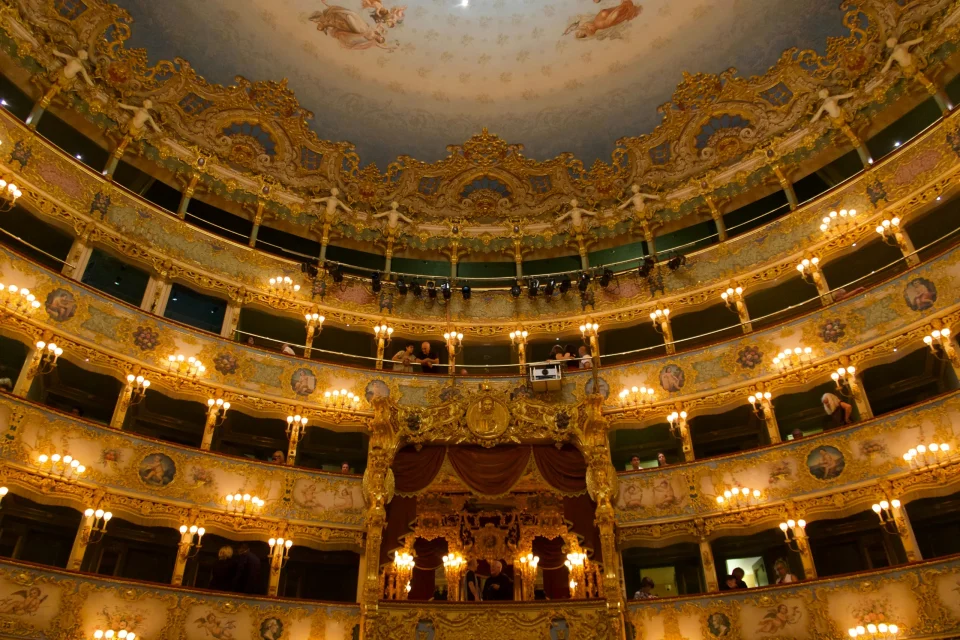 Golden balconies inside an ornate opera house