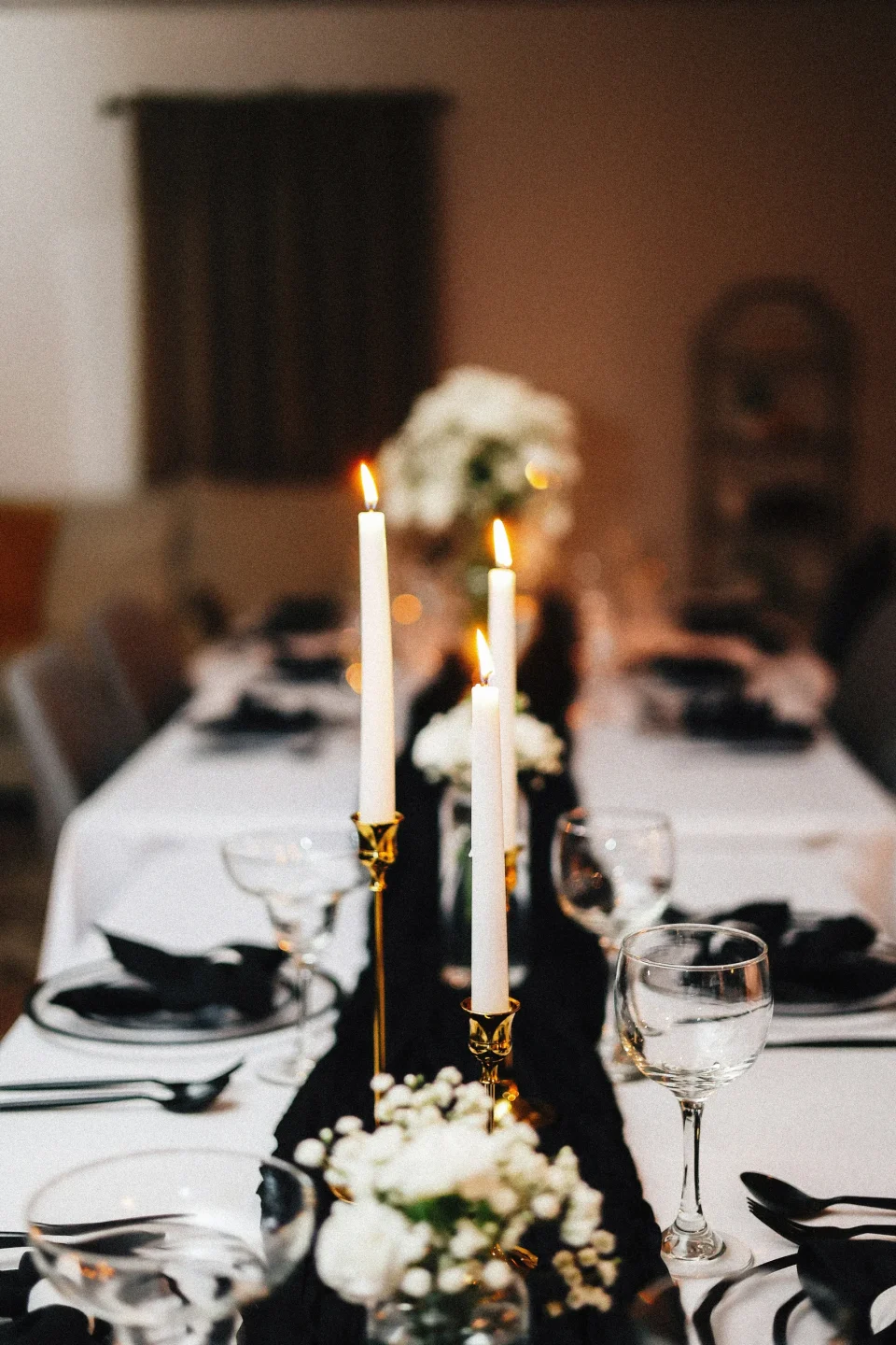 Dinner table set with flowers and candles