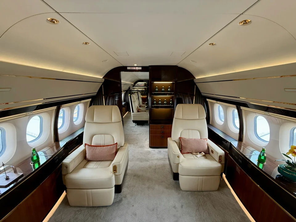 Cream leather seats inside a private jet cabin