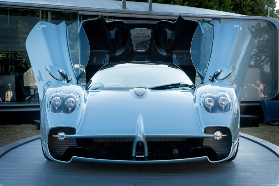 Blue Pagani with its doors raised