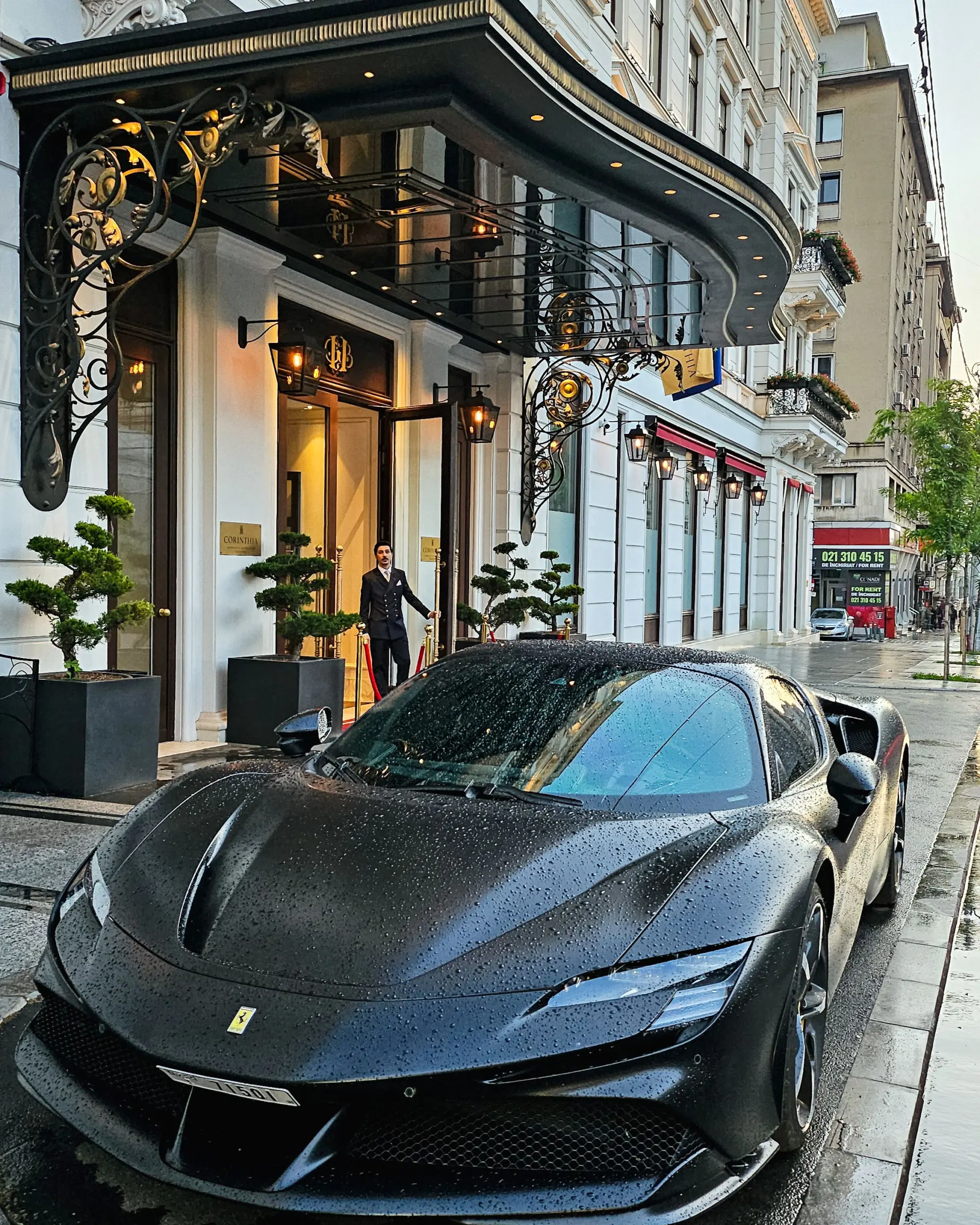 Luxury sports car outside an elegant hotel