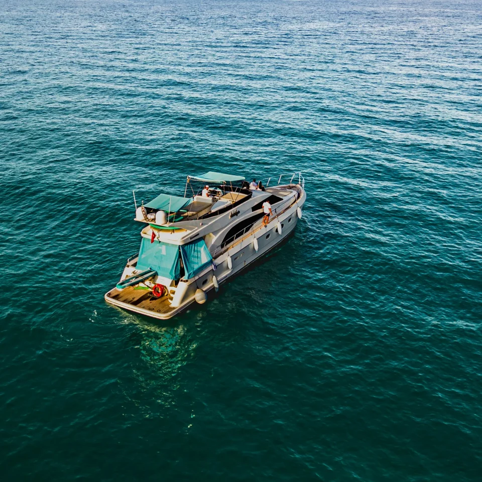 Motor yacht viewed from above on blue water